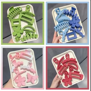 Four sets of vibrant matte hair claw clips in green, blue, pink, and red colors