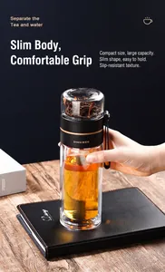 Close-up of a double-wall glass tea infuser bottle with a separate tea compartment.