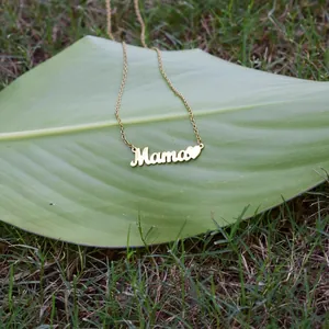Detail of gold Mama letter necklace with heart pendant, titanium steel jewelry gift.