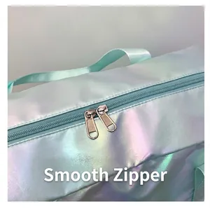 Close-up detail of smooth double metal zippers on iridescent holographic sports bag