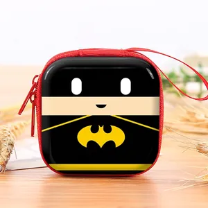 Close-up of square tinplate coin purse featuring cartoon character design and red zipper.