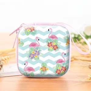 Square tinplate coin purse featuring a pink flamingo and tropical floral pattern.