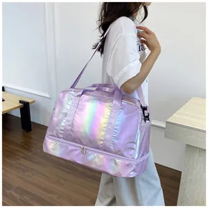 Model carrying a holographic iridescent purple travel bag with dry-wet separation
