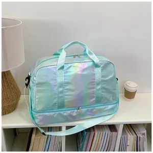 Holographic mint green gym bag with dry-wet separation compartments on white shelf