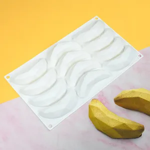 Detailed view of banana-shaped silicone mousse mold and finished dessert samples