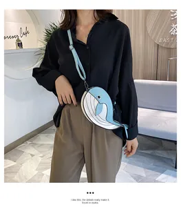 Adorable cartoon whale shaped crossbody bag for women featuring cute blue and white design
