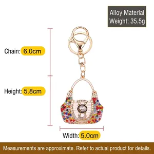 Dainty alloy keychain featuring a colorful rhinestone handbag pendant with a gold hook