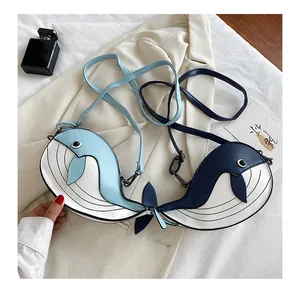 Detailed view of cute Japanese cartoon whale crossbody bags in light and dark blue
