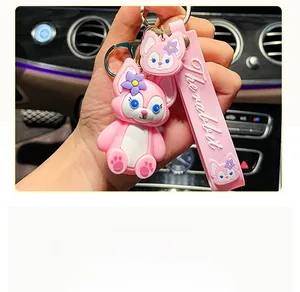 Close-up detail of a cute pink LinaBell character keychain with The Rabbit strap