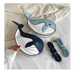 Adorable whale-shaped crossbody bags featuring blue and white contrast leather colors