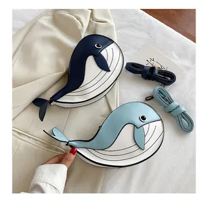 Cute cartoon whale-shaped crossbody bag in blue and white color block fashion design.