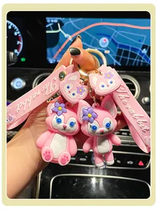 Close-up of cute pink LinaBell character keychain with embossed rabbit wrist strap