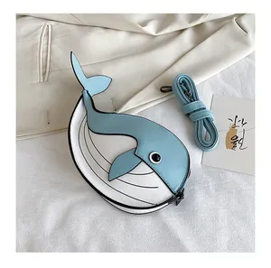 Cute cartoon whale-shaped crossbody bag in blue and white contrast with matching strap