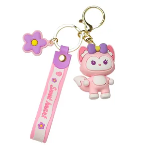 Cute pink fox cartoon keychain with pink wrist strap and purple flower charm pendant
