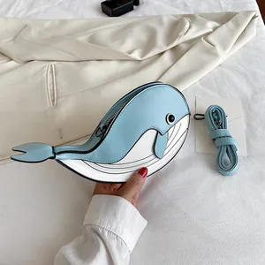 Detailed close-up showing the cute whale cartoon crossbody bag with matching strap