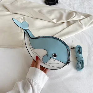 Cute cartoon whale-shaped crossbody bag featuring blue and white leather with a shoulder strap