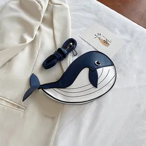 Cute navy and white whale-shaped crossbody bag with contrast colors and strap.
