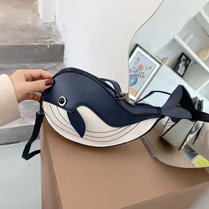 Detail view of a cute cartoon whale crossbody bag with creative color contrast design.