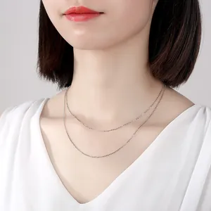 Elegant S925 sterling silver double-layer cross chain necklace on model