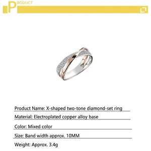 Detailed view of dual-tone X-shaped ring with pavé-set crystals and plated finish