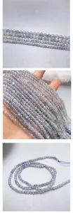 Close-up of faceted grey moonstone beads showing natural blue labradorescence flash