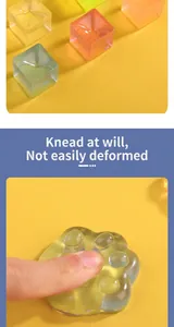 Close-up showing the soft and flexible texture of the transparent cat paw squishy toy.