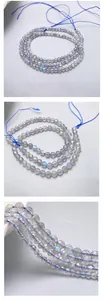 Close-up detail of natural grey moonstone faceted beads with blue flash