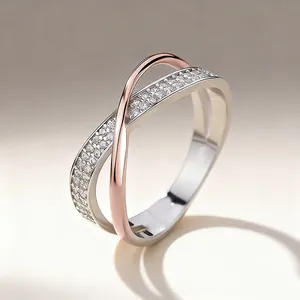 Close-up detail of an elegant X-shaped two-tone ring featuring micro-pave cubic zirconia
