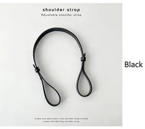 Close-up detail of a minimalist black adjustable PU leather shoulder strap replacement