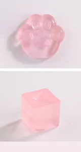 Detail view of translucent pink cat paw and cube shaped squishy jelly stress relief toys
