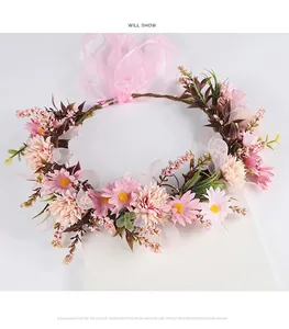 Elegant forest-style bridal flower crown with handmade artificial pink daisies and ribbon.