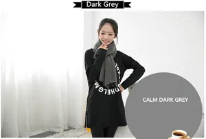 Detailed view of an Asian model wearing a soft dark grey imitation cashmere winter scarf.
