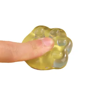 Cute transparent yellow cat paw squishy toy for effective stress relief and venting