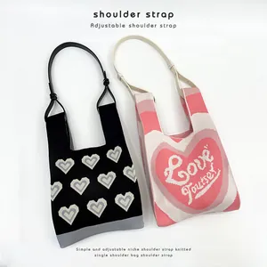 Trendy knitted heart pattern shoulder bags featuring adjustable black and white PU straps