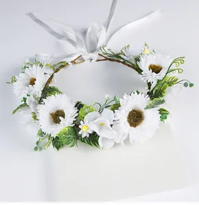 Detailed view of handmade white forest-style bridal flower crown with ribbon ties