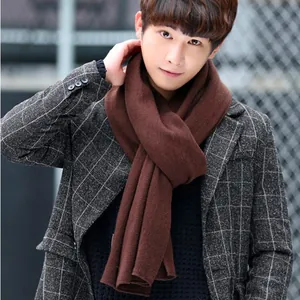 Elegant men's autumn winter warm solid dark brown knitted scarf paired with plaid coat