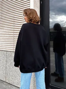 Back view of a black oversized crew neck polar fleece sweatshirt with a casual street fit