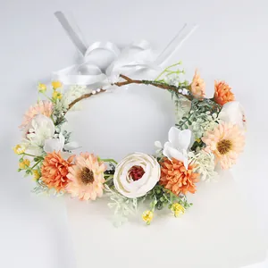 Elegant handmade bridal floral crown with peach and white artificial flowers for weddings