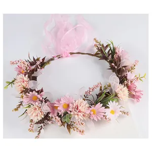 Mori style artificial floral crown with pink daisies and sheer ribbons for brides