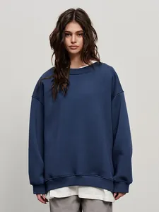 Detail view of navy blue oversized crewneck sweatshirt for women with soft fabric