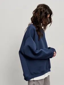 Detailed side view of an oversized navy blue polar fleece sweatshirt for women street style
