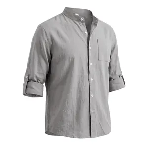 Detailed shot of a grey linen men's shirt featuring a stand collar and buttoned chest pocket.
