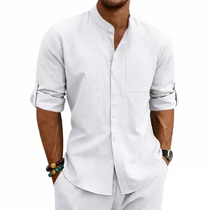 Detail of white linen mandarin collar shirt with rolled sleeves and chest pocket