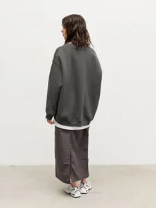 Back view of women's oversized dark gray crewneck sweatshirt with dropped shoulders