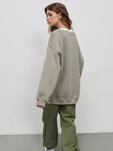 Oversized women's khaki green crewneck fleece sweatshirt, back view streetwear style