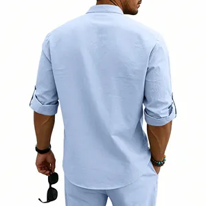 Back view of a men's light blue linen shirt with rolled sleeves and stand collar.