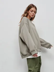 Oversized minimalist khaki crewneck sweatshirt for women in a street layering style