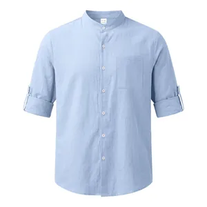 Front view of a light blue linen stand collar shirt with roll-up sleeves.