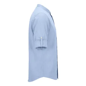 Detailed side profile of a men's light blue linen shirt with rolled-up button-tab sleeves