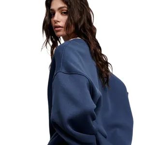 Women's oversized solid blue crewneck sweatshirt in a trendy streetwear style look